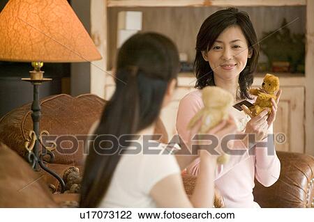 Two Mid Adult Women Holding a Teddy Bear View Large Photo Image Stock Image - Two Mid Adult Women Holding a Teddy Bear. Fotosearch