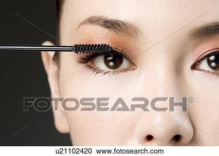 Young Woman Applying Mascara View Large Photo Image Stock Image - Young Woman Applying Mascara. Fotosearch