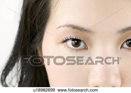 Young Woman Looking at Camera, Close Up View Large Photo Image Stock Photo - Young Woman Looking at Camera, Close Up. Fotosearch