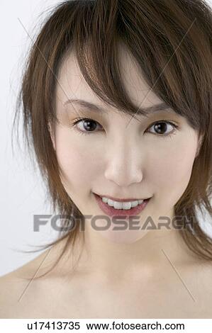 Stock Photography - Young Woman Looking at Camera. Fotosearch