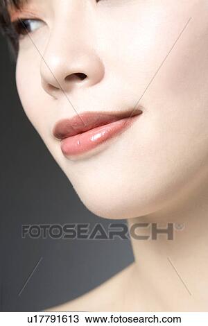 Stock Image - Young Woman Looking down. Fotosearch