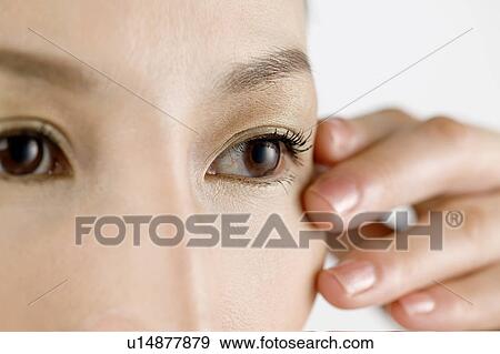 Young Woman Touching Face, Close Up View Large Photo Image Stock Photo - Young Woman Touching Face, Close Up. Fotosearch
