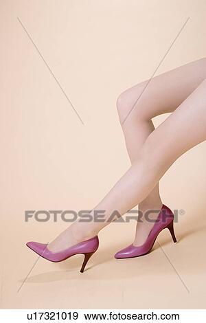 Stock Photo - Young Woman's Legs, Sitting. Fotosearch