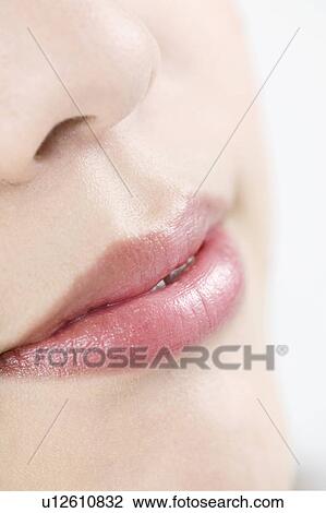 Stock Image - Young Woman's Lips, Nose, Close Up. Fotosearch
