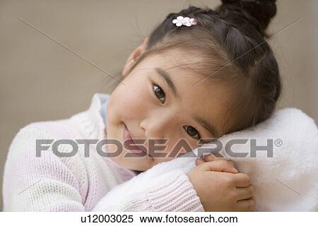 Stock Photography - Girl holding a clean towel. Fotosearch
