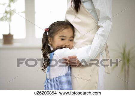 Girl hugging her mother View Large Photo Image Picture - Girl hugging her mother. Fotosearch