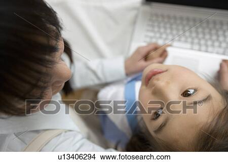 Picture - Girl looking up to see her mother. Fotosearch