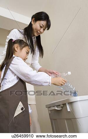 Girl smashing a PET bottle for a recycle View Large Photo Image Stock Image - Girl smashing a PET bottle for a recycle. Fotosearch
