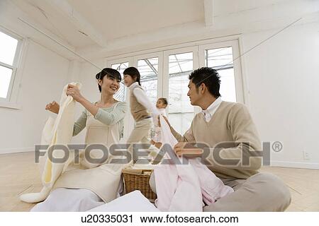 Husband helping the laundry View Large Photo Image Stock Image - Husband helping the laundry. Fotosearch