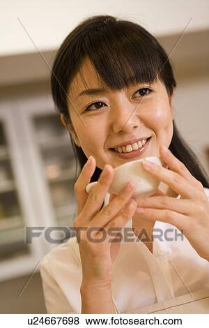 Mid Adult Woman drinking a tea View Large Photo Image Stock Photo - Mid Adult Woman drinking a tea. Fotosearch