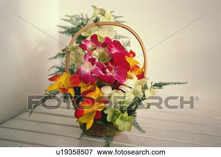 Stock Photo - Closed Up Image of a Flower Basket on the Table. Fotosearch