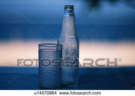 Closed Up Image of a Glass and a Bottle, Differential Focus View Large Photo Image Picture - Closed Up Image of a Glass and a Bottle, Differential Focus. Fotosearch