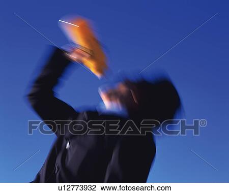 Businessman Drinking, Low Angle View, Long Exposure View Large Photo Image Stock Image - Businessman Drinking, Low Angle View, Long Exposure. Fotosearch