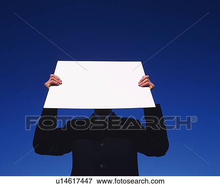 Businessman Holding Up A Card, Low Angle View, Copy Space View Large Photo Image Stock Photo - Businessman Holding Up A Card, Low Angle View, Copy Space. Fotosearch