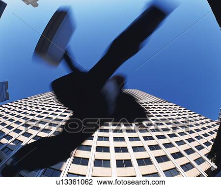 Businessman Jumping, Low Angle View, Long Exposure View Large Photo Image Stock Image - Businessman Jumping, Low Angle View, Long Exposure. Fotosearch