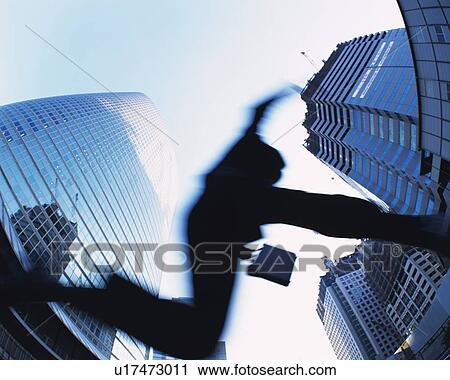 Businessman Jumping, Low Angle View, Long Exposure, Fish Eye View Large Photo Image Stock Image - Businessman Jumping, Low Angle View, Long Exposure, Fish Eye. Fotosearch