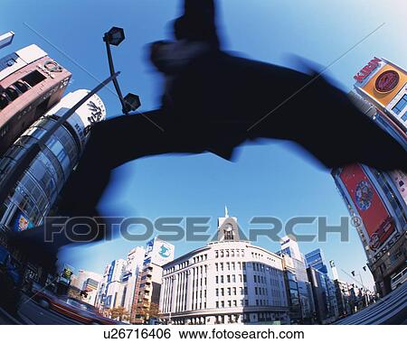 Businessman Jumping, Low Angle View, Long Exposure, Fish Eye View Large Photo Image Stock Photograph - Businessman Jumping, Low Angle View, Long Exposure, Fish Eye. Fotosearch
