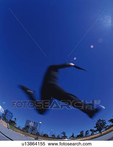 Businessman Jumping, Low Angle View, Lens Flare, Long Exposure, Fish Eye, Copy Space View Large Photo Image Stock Photography - Businessman Jumping, Low Angle View, Lens Flare, Long Exposure, Fish Eye, Copy Space. Fotosearch