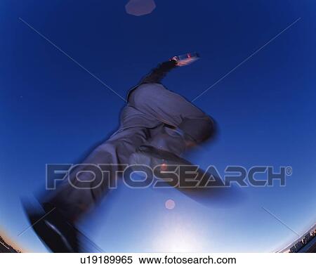 Businessman Jumping, Low Angle View, Lens Flare, Long Exposure View Large Photo Image Stock Photography - Businessman Jumping, Low Angle View, Lens Flare, Long Exposure. Fotosearch