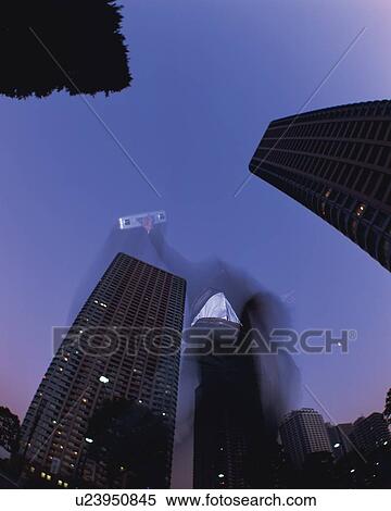 Businessman Jumping, Low Angle View, Long Exposure, Fish Eye, Night View View Large Photo Image Stock Photography - Businessman Jumping, Low Angle View, Long Exposure, Fish Eye, Night View. Fotosearch