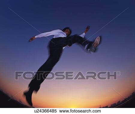 Businessman Jumping, Low Angle View, Long Exposure, Fish Eye View Large Photo Image Stock Photography - Businessman Jumping, Low Angle View, Long Exposure, Fish Eye. Fotosearch