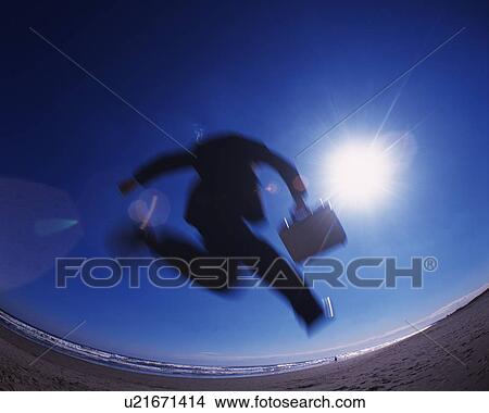 Businessman Jumping, Rear View, Low Angle View, Lens Flare, Long Exposure, Fish Eye View Large Photo Image Picture - Businessman Jumping, Rear View, Low Angle View, Lens Flare, Long Exposure, Fish Eye. Fotosearch