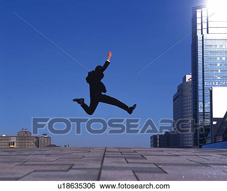Stock Photograph - Businessman Jumping, Side View, Copy Space. Fotosearch