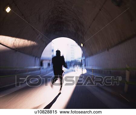 Businessman Running in Tunnel, Rear View, Blurred Motion View Large Photo Image Stock Photography - Businessman Running in Tunnel, Rear View, Blurred Motion. Fotosearch
