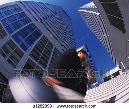 Businessman Running, Low Angle View, Lens Flare, Long Exposure, Fish Eye View Large Photo Image Stock Image - Businessman Running, Low Angle View, Lens Flare, Long Exposure, Fish Eye. Fotosearch