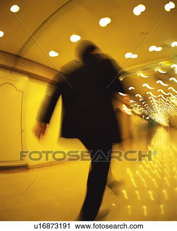 Businessman Running, Rear View, Low Angle View, Long Exposure View Large Photo Image Stock Image - Businessman Running, Rear View, Low Angle View, Long Exposure. Fotosearch