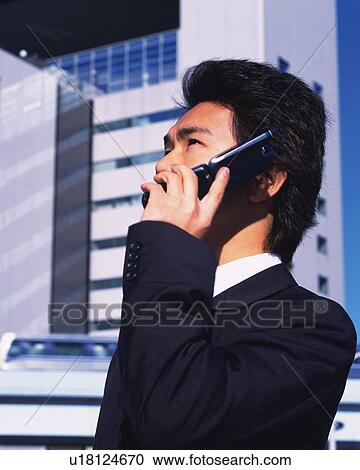 Businessman Talking on Mobile Phone, Side View, Differential Focus View Large Photo Image Stock Image - Businessman Talking on Mobile Phone, Side View, Differential Focus. Fotosearch