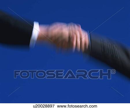Shaking Hands, Low Angle View, Long Exposure View Large Photo Image Stock Photo - Shaking Hands, Low Angle View, Long Exposure. Fotosearch
