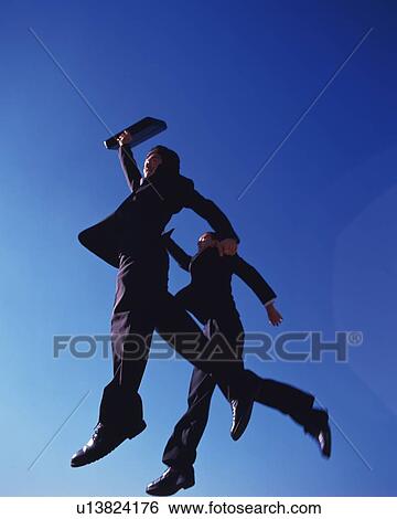 Two Businessmen Jumping, Low Angle View, Lens Flare, Long Exposure View Large Photo Image Stock Photograph - Two Businessmen Jumping, Low Angle View, Lens Flare, Long Exposure. Fotosearch