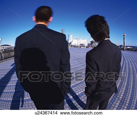 Two Businessmen Standing, Rear View, Fish Eye View Large Photo Image Picture - Two Businessmen Standing, Rear View, Fish Eye. Fotosearch