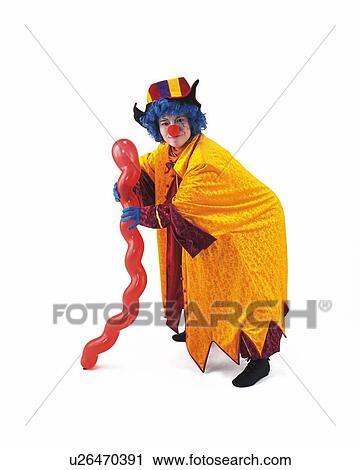 Stock Image - Portrait of Clown Holding Balloon Stick, Front View . Fotosearch