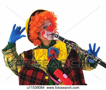 Picture - Portrait of Clown Plying Clarinet, High Angle View . Fotosearch