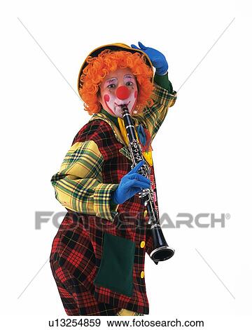 Stock Photo - Portrait of Clown Plying Clarinet, High Angle View . Fotosearch