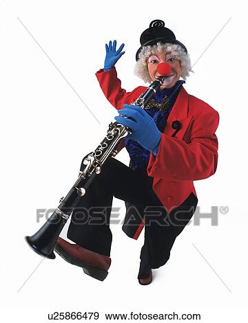 Stock Photo - Portrait of Clown Plying Clarinet, High Angle View . Fotosearch