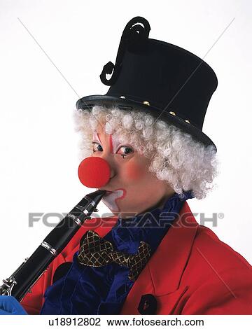 Stock Image - Portrait of Clown Plying Clarinet, Front View . Fotosearch