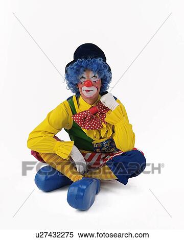 Stock Photography - Portrait of Clown Posing, Plying Drum, Clarinet, Drum, Front View . Fotosearch