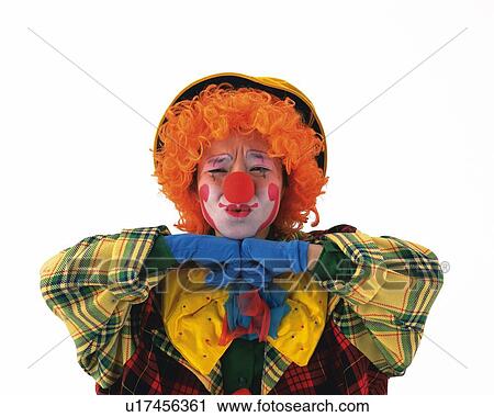 Stock Image - Portrait of Clown Posing With Embarrassed Expression, Front View . Fotosearch