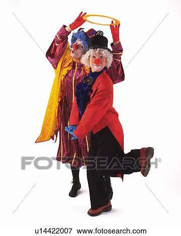 Stock Photo - Portrait of Clowns Gesturing, Holding Ring, Front View. Fotosearch