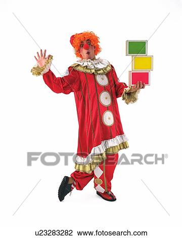 Stock Image - Portrait of Clowns Holding Blocks, Front View. Fotosearch
