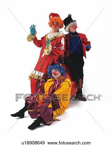 Stock Photo - Portrait of Clowns Posing, Two Clowns Standing and One Clown Crouching, Front View . Fotosearch