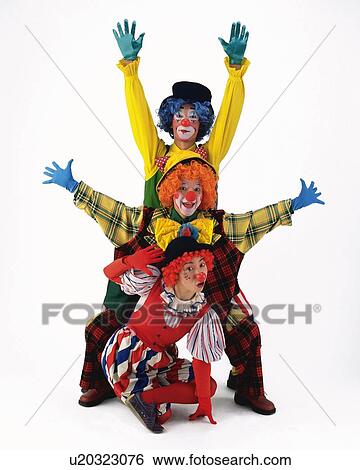 Stock Photograph - Portrait of Clowns Raised Arms, Front View . Fotosearch
