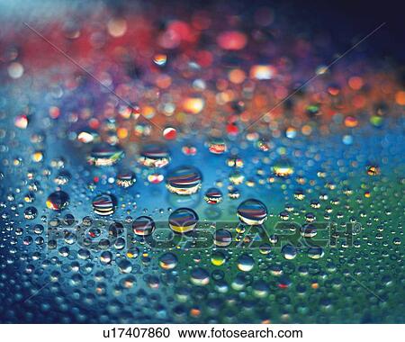 Stock Image - Dew on the Rainbow Color, Close Up, Differential Focus, In Focus, Out Focus,. Fotosearch