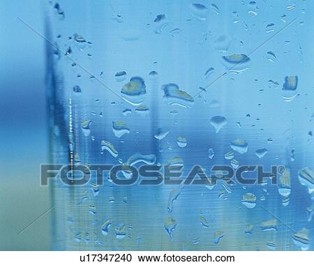 Stock Image - Dew on the Surface of Glass, Close Up, Differential Focus, In Focus, Out Focus. Fotosearch