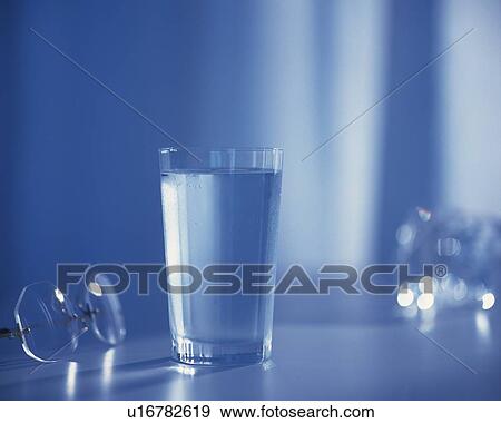 Glass of Water on a Table, Close Up, Front View, Toned Image, Differential Focus, In Focus, Out Focus, View Large Photo Image Stock Photo - Glass of Water on a Table, Close Up, Front View, Toned Image, Differential Focus, In Focus, Out Focus,. Fotosearch
