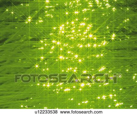 Stock Photo - Glittering Water, High Angle View, Close Up, Lens Flare, Toned Image. Fotosearch