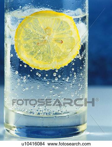Iced Lemon Water in a Glass, Close Up, Differential Focus, In Focus, Out Focus, Front View View Large Photo Image Picture - Iced Lemon Water in a Glass, Close Up, Differential Focus, In Focus, Out Focus, Front View. Fotosearch